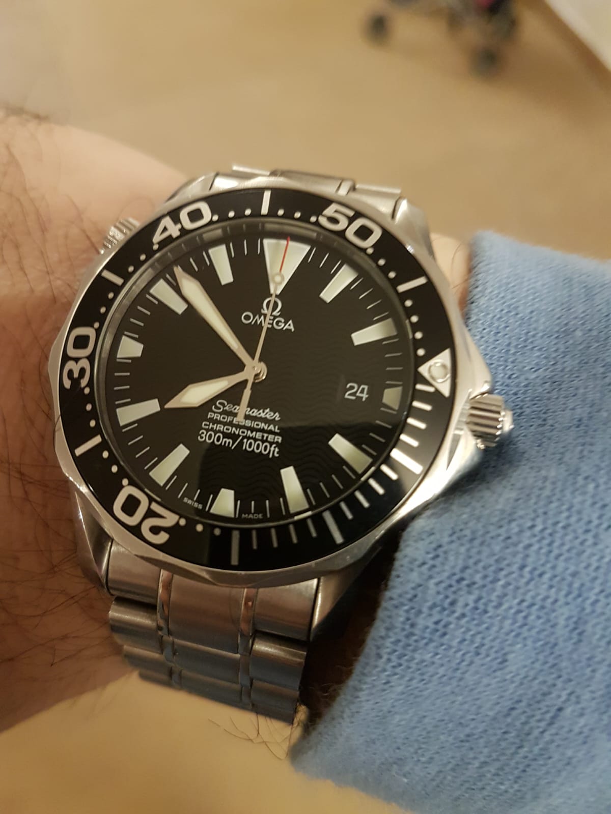 Man wearing an Omega seamaster dark blake 300